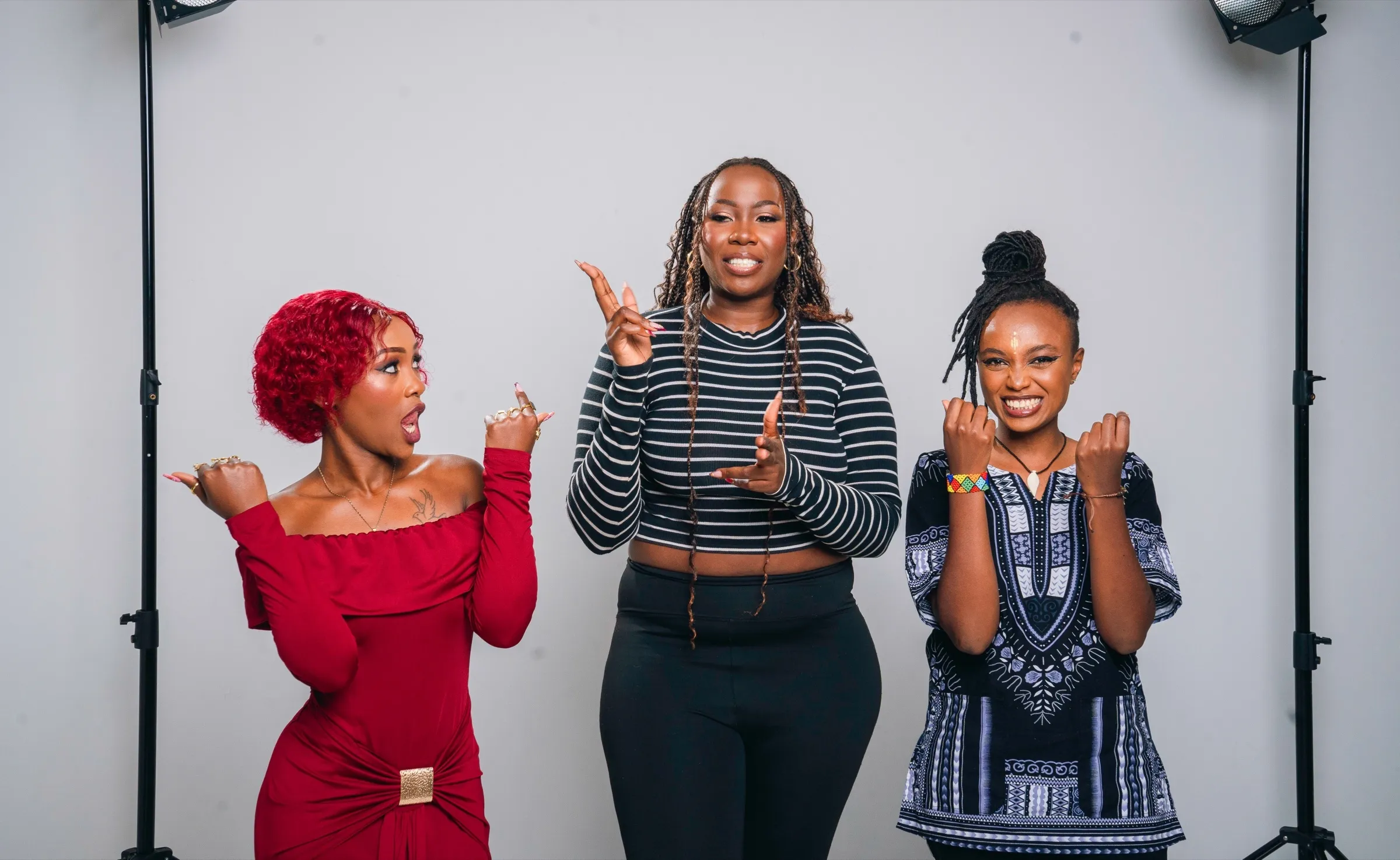 Three TWSS women posing in a Nairobi studio